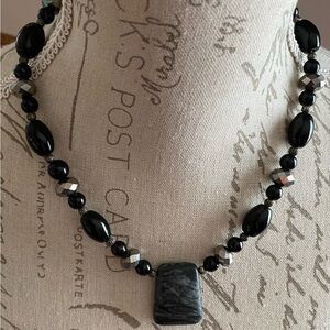 Beautiful beaded necklace with a stone like pendant